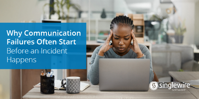woman at desk in front of laptop stressed out