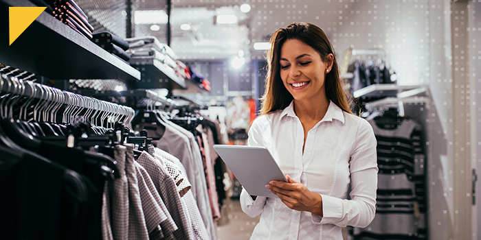 woman in retail setting on ipad