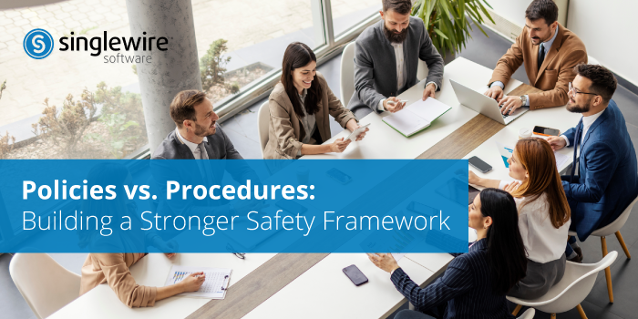 people at a conference table discussing safety policies and procedures.