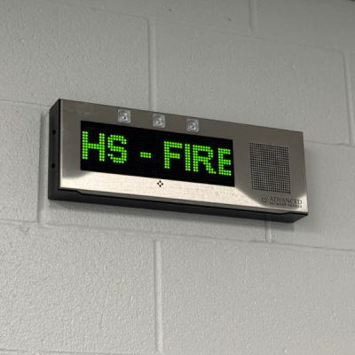 speaker showing a fire drill message in a school