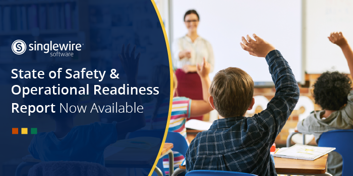 student raising hand in classroom