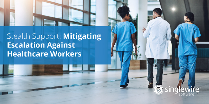 healthcare workers walking through a hospital