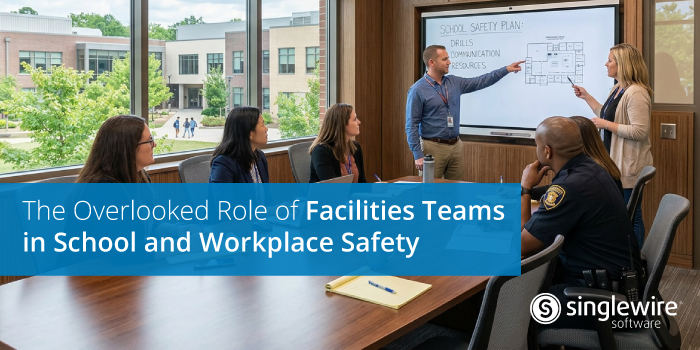 facilities team talking over safety strategy at a conference table