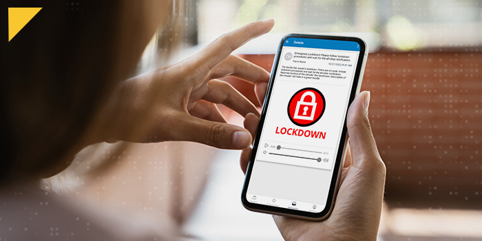 Person reading lockdown alert form InformaCast on their mobile device