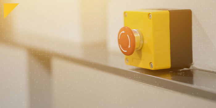 A large yellow panic button device