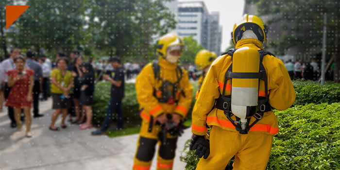 Firefighters outside of a building