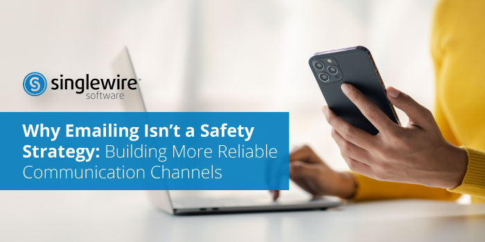 person emailing on their laptop and phone