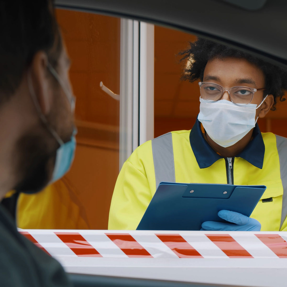 manufacturing employee checks in visitor