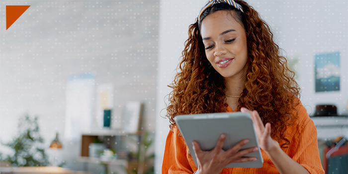 woman smiling using tablet