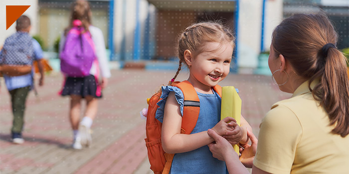 child getting dropped off at school