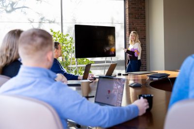 SInglewire employees working together in conference room